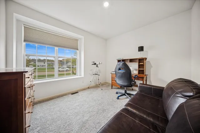 a view of a closet with storage and utility room