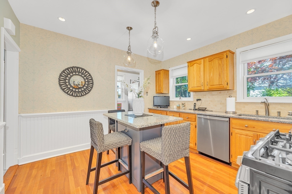 112 Perham Street Boston, MA 02132 - Photo 15 of 36 a large kitchen with a table and chairs in it