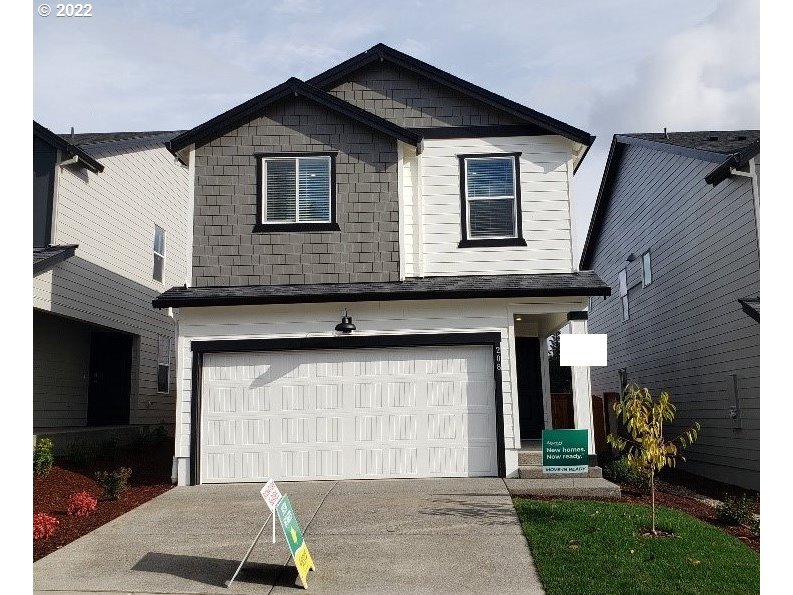 208 Northeast 28th Court Ridgefield, WA 98642 - Photo 1 of 19 a front view of a house with garden