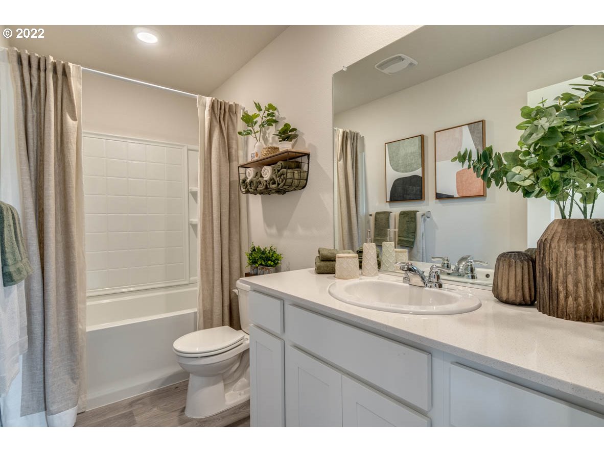 208 Northeast 28th Court Ridgefield, WA 98642 - Photo 11 of 19 a bathroom with a sink a toilet and shower
