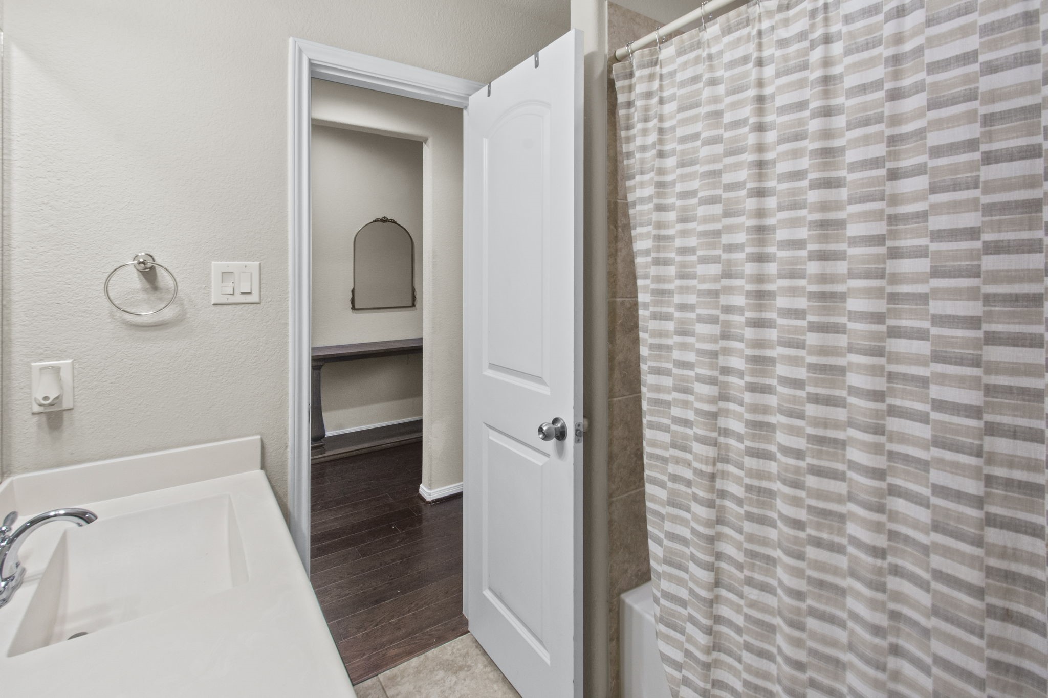 4551 Axis Trail Conroe, TX 77303 - Photo 4 of 12 a bathroom with a sink and a shower