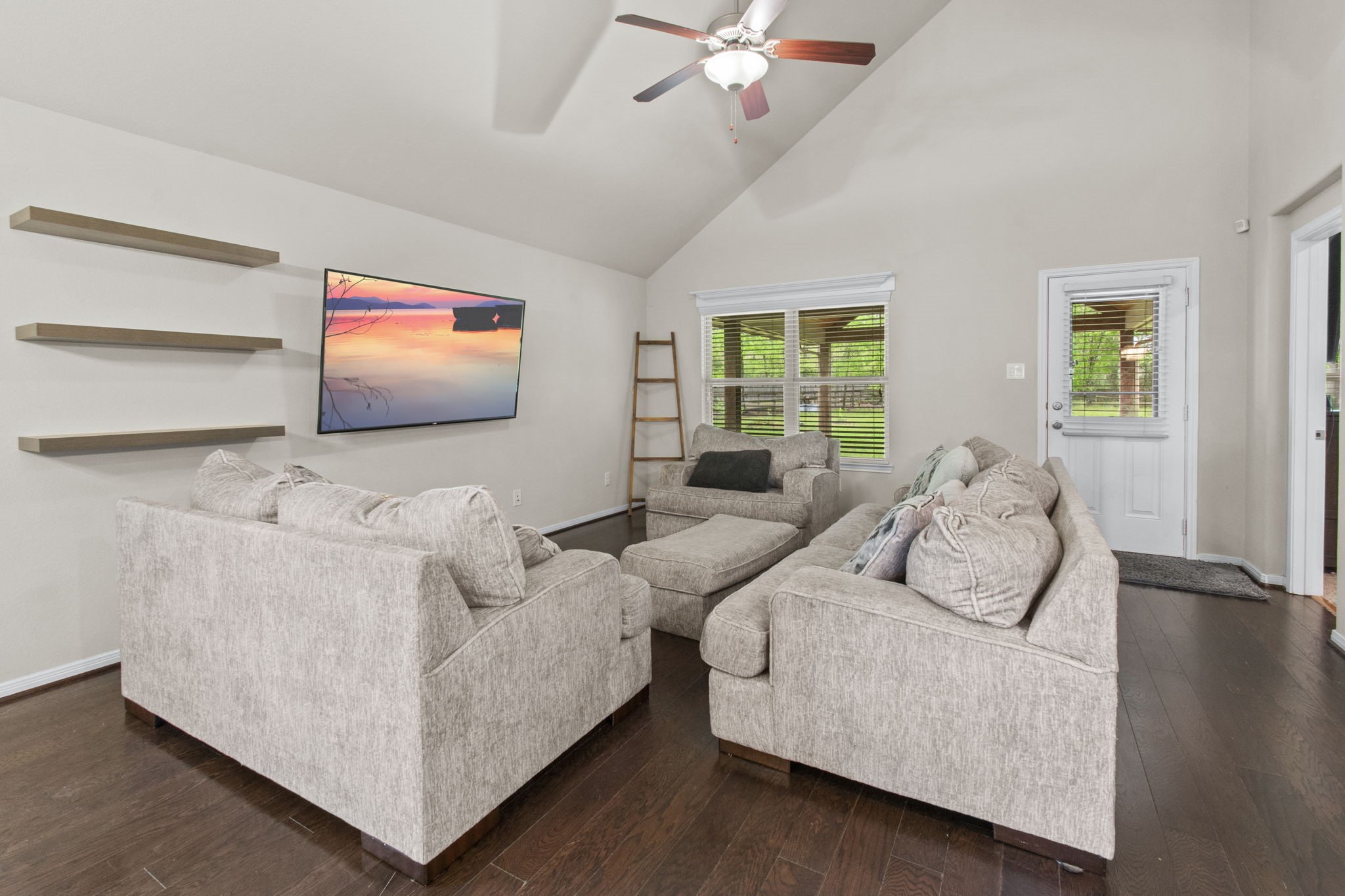 4551 Axis Trail Conroe, TX 77303 - Photo 8 of 12 a living room with furniture and a flat screen tv