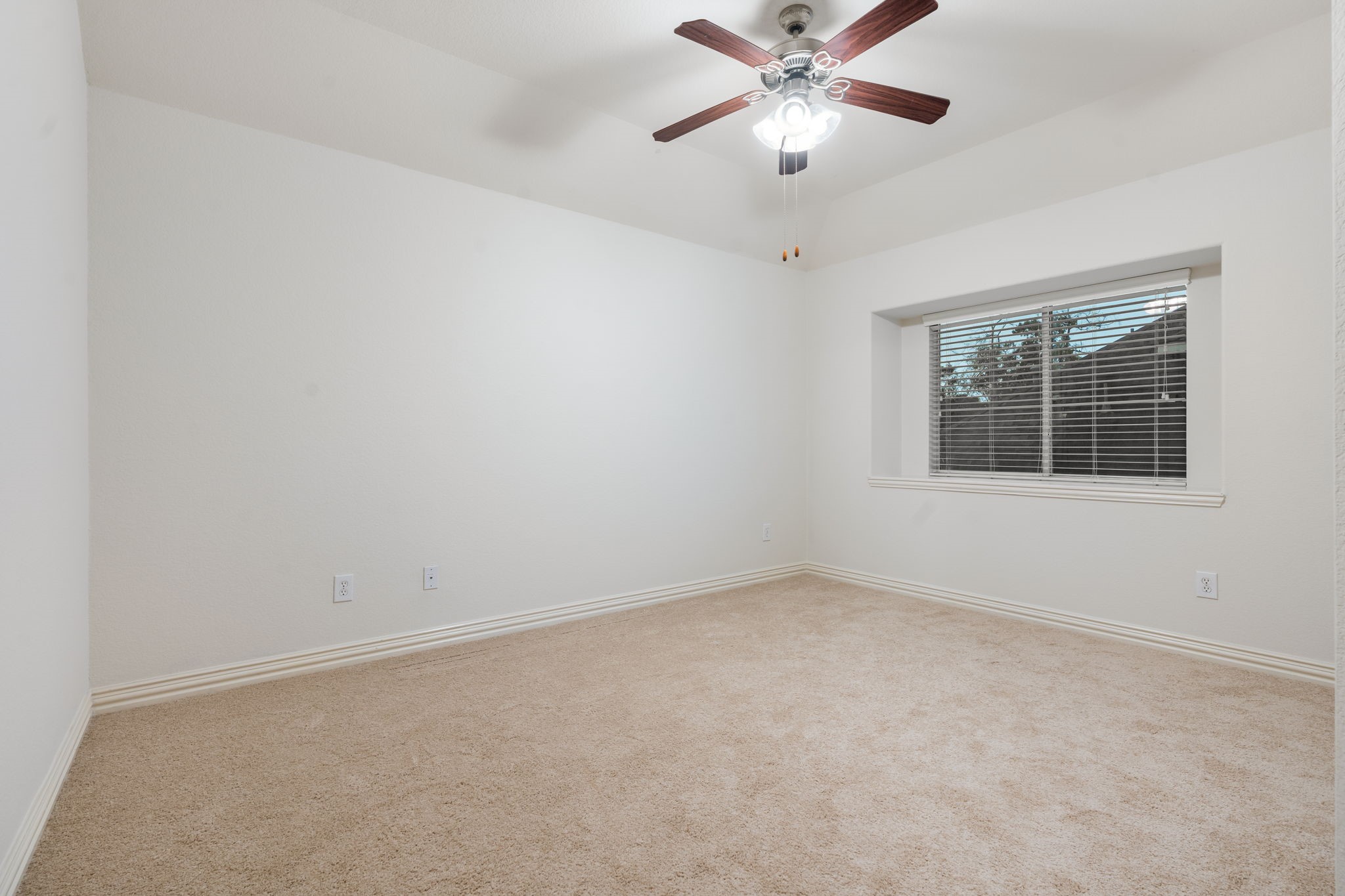 307 Arbor Ridge Lane Conroe, TX 77384 - Photo 30 of 50 an empty room with a window and a fan