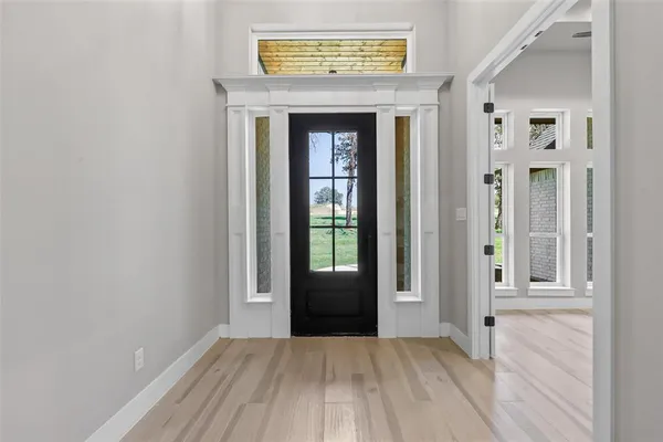 wooden floor and a fireplace in a room