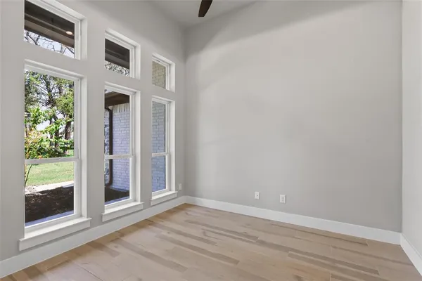 a view of an entryway with wooden floor and door