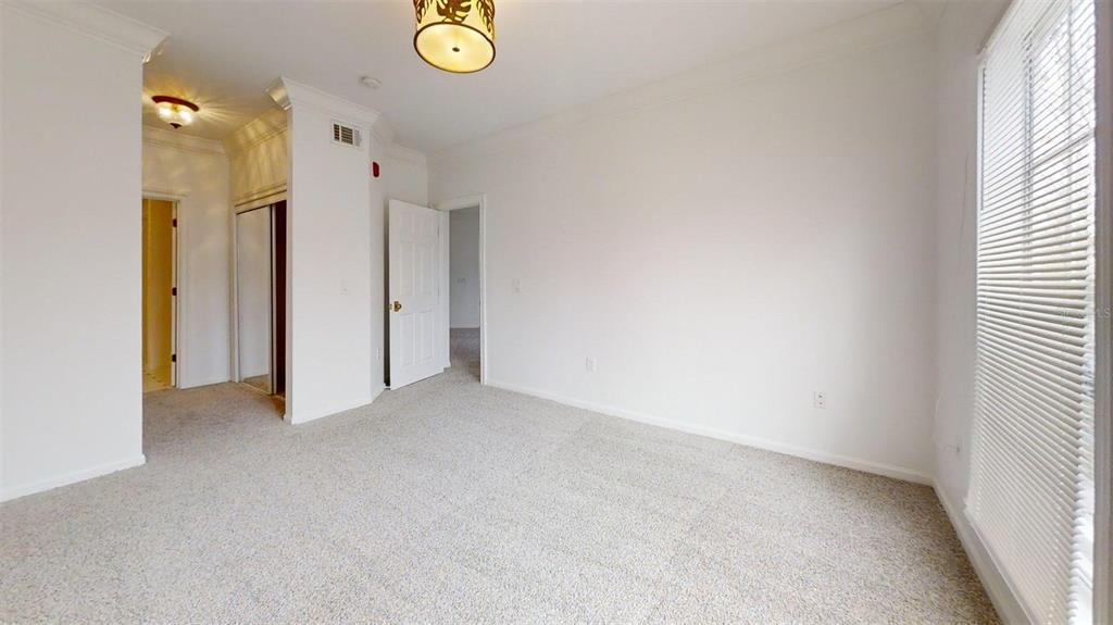 460 Water Street, Unit 460 Celebration, FL 34747 - Photo 15 of 38 an empty room with windows