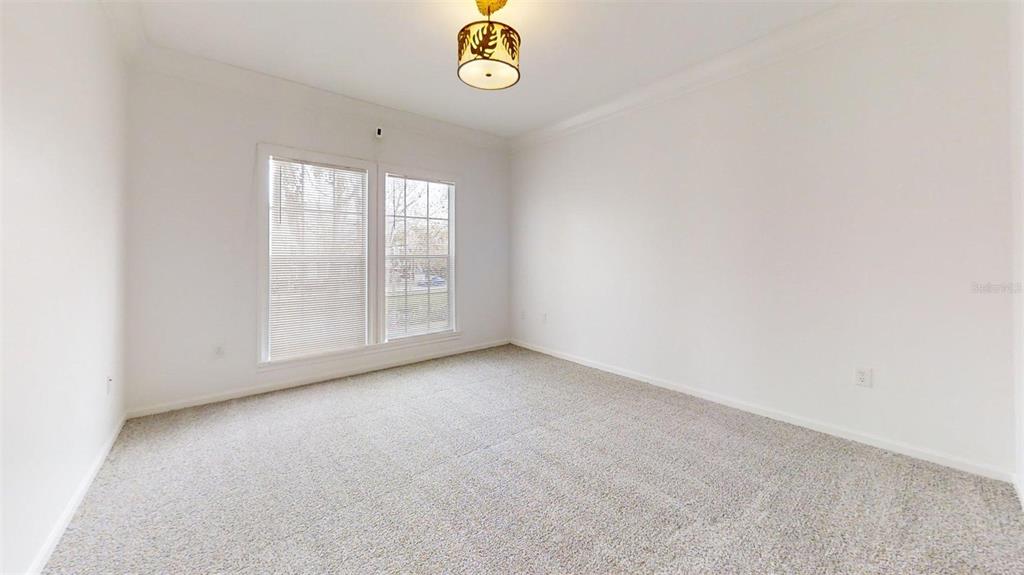 460 Water Street, Unit 460 Celebration, FL 34747 - Photo 16 of 38 a view of an empty room with a window