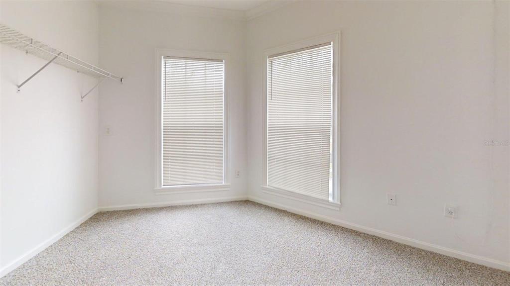 460 Water Street, Unit 460 Celebration, FL 34747 - Photo 20 of 38 an empty room with window