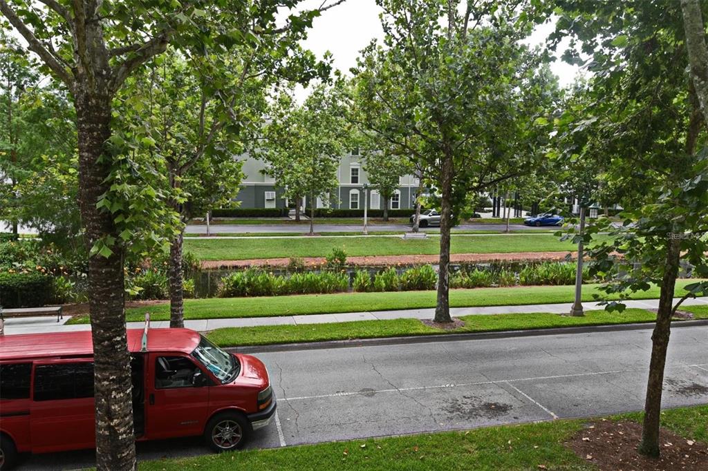 460 Water Street, Unit 460 Celebration, FL 34747 - Photo 22 of 38 a front view of a house with a yard