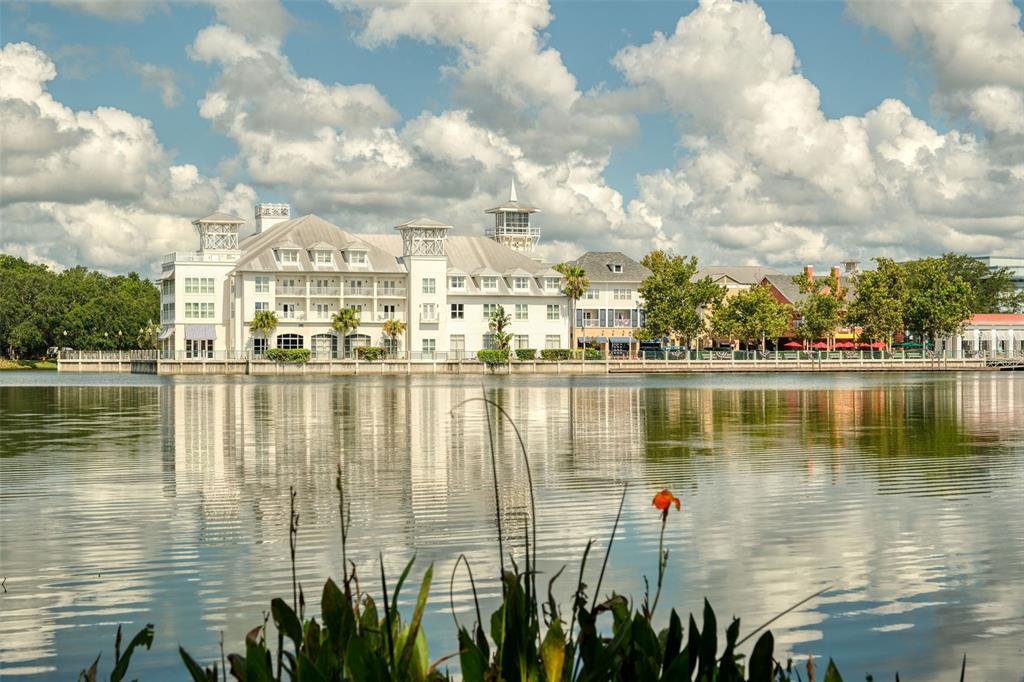 460 Water Street, Unit 460 Celebration, FL 34747 - Photo 31 of 38 a view of a lake with boats next to large trees