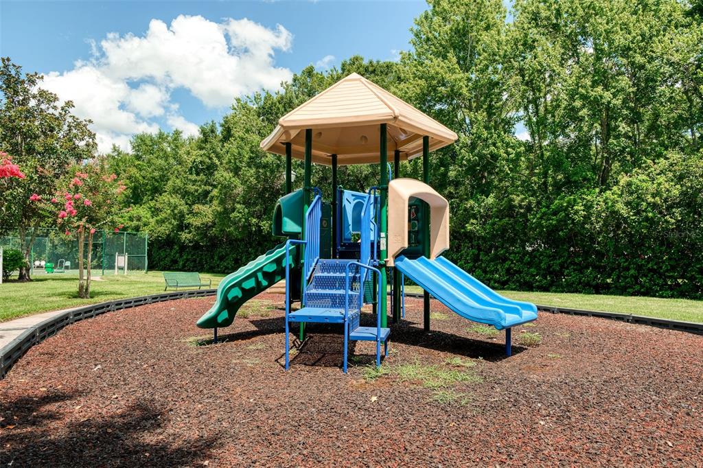 460 Water Street, Unit 460 Celebration, FL 34747 - Photo 32 of 38 a park view with a bench in the park