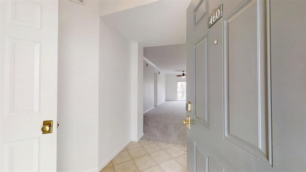 460 Water Street, Unit 460 Celebration, FL 34747 - Photo 5 of 38 a view of a hallway with wooden floor