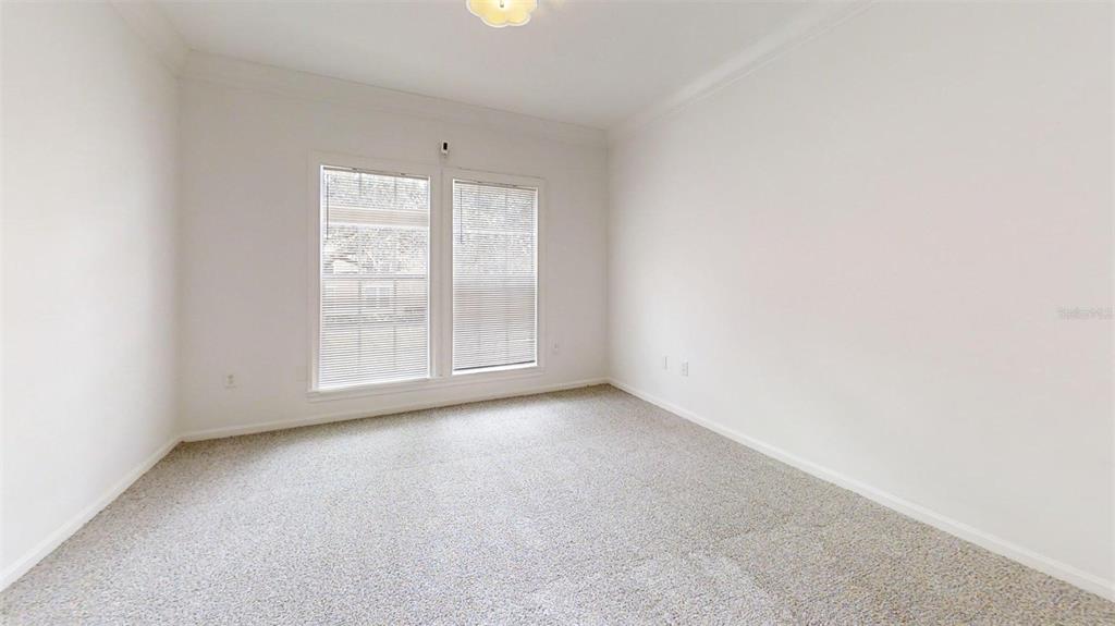 460 Water Street, Unit 460 Celebration, FL 34747 - Photo 9 of 38 an empty room with windows