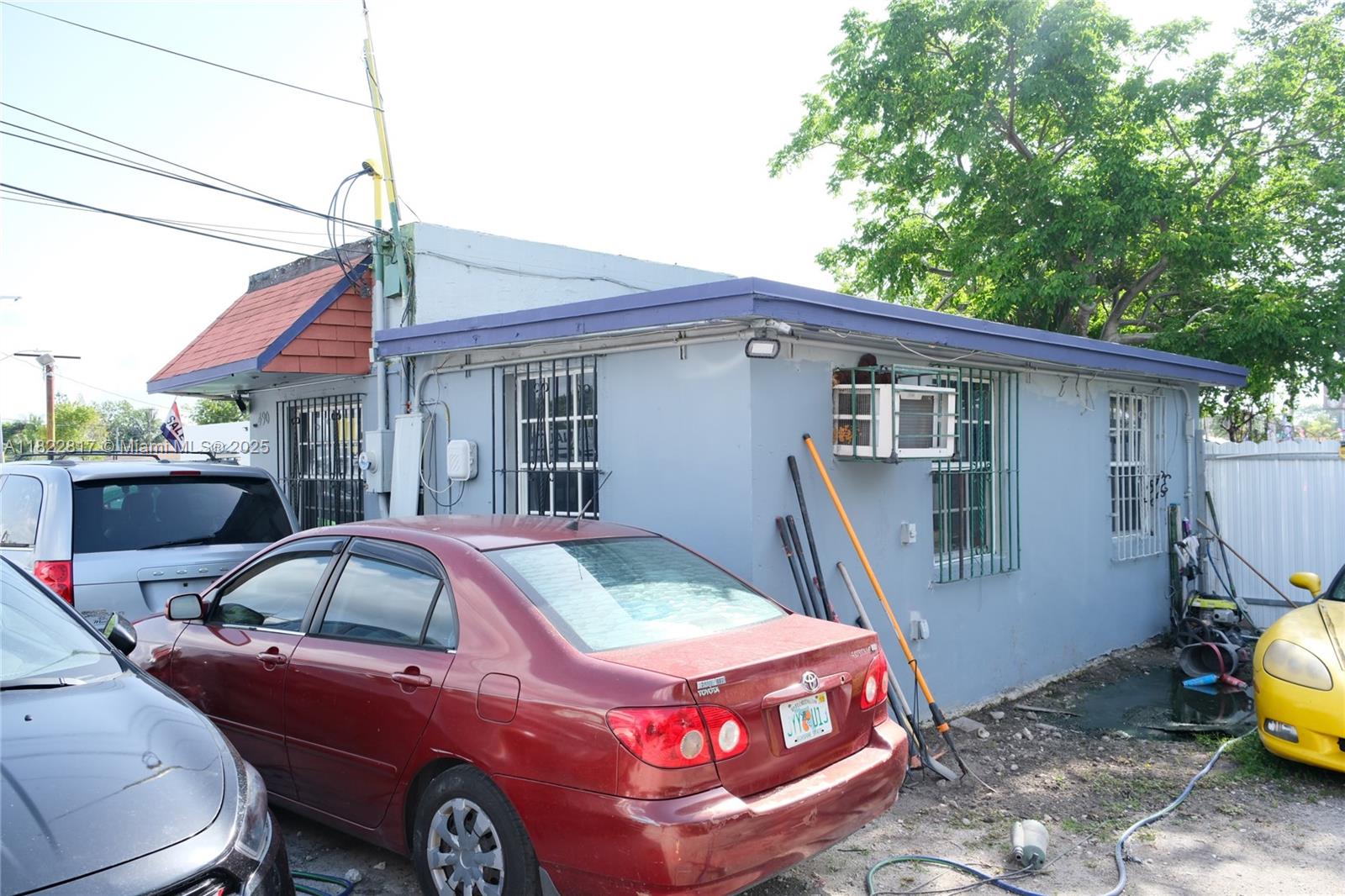 490 Northwest 79th Street Miami, FL 33150 - Photo 4 of 5 a front view of a house with parking space