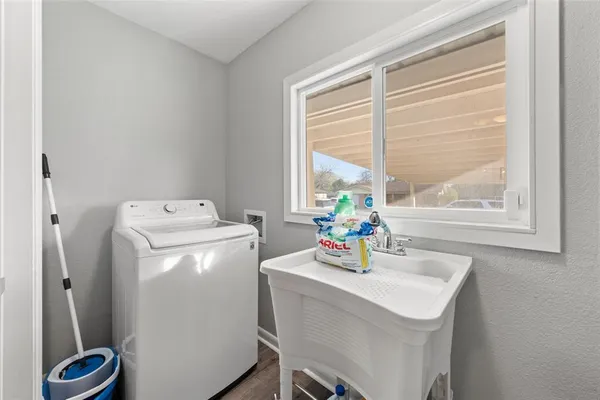 a dining room with a window and washer