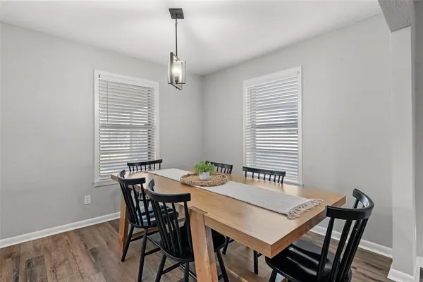 a view of a dining room with furniture window and wooden floor