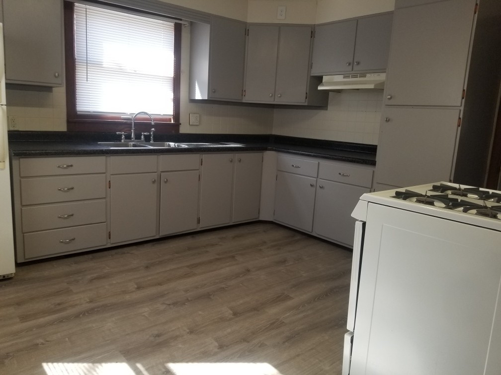 809 Calhoun Street Peru, IL 61354 - Photo 2 of 7 a kitchen with appliances cabinets and a sink