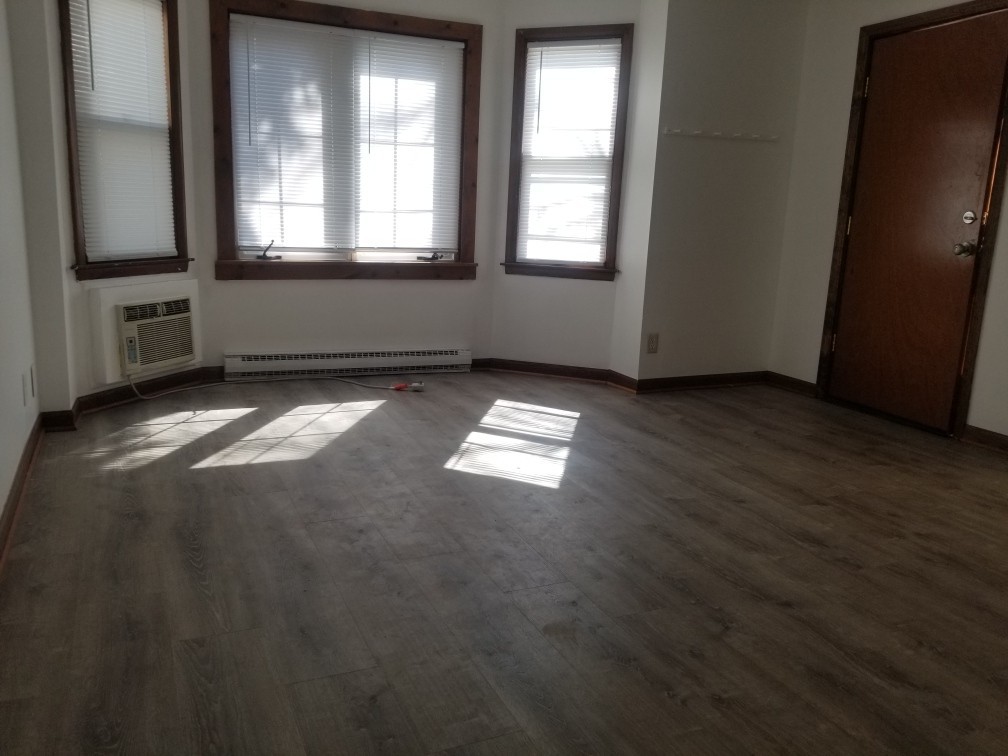 809 Calhoun Street Peru, IL 61354 - Photo 3 of 7 an empty room with windows