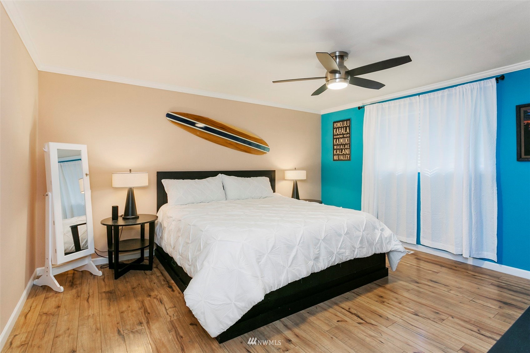 610 219th Place Southwest Bothell, WA 98021 - Photo 11 of 25 a bedroom with a bed and a ceiling fan