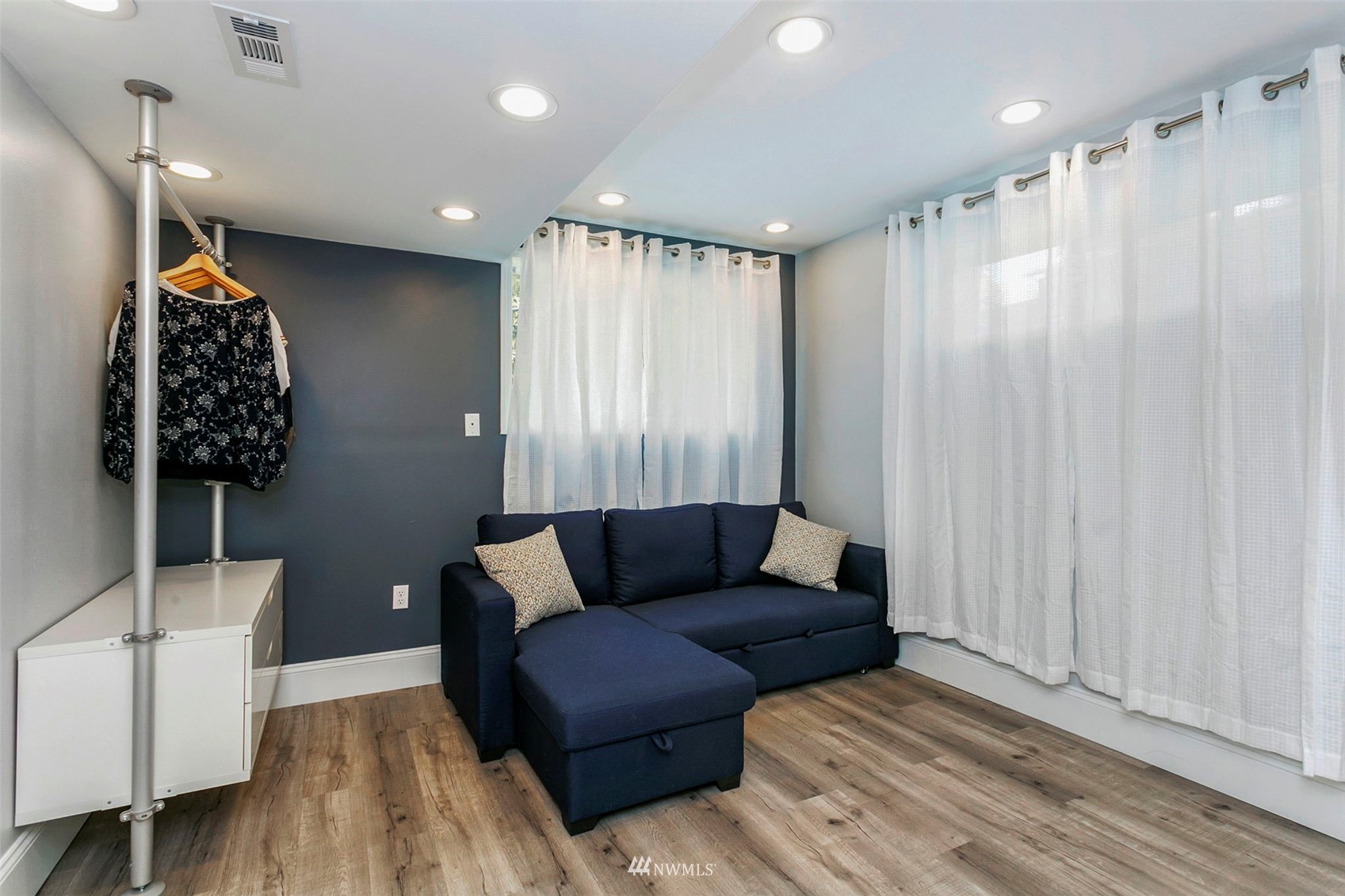 610 219th Place Southwest Bothell, WA 98021 - Photo 17 of 25 a living room with furniture and a rug