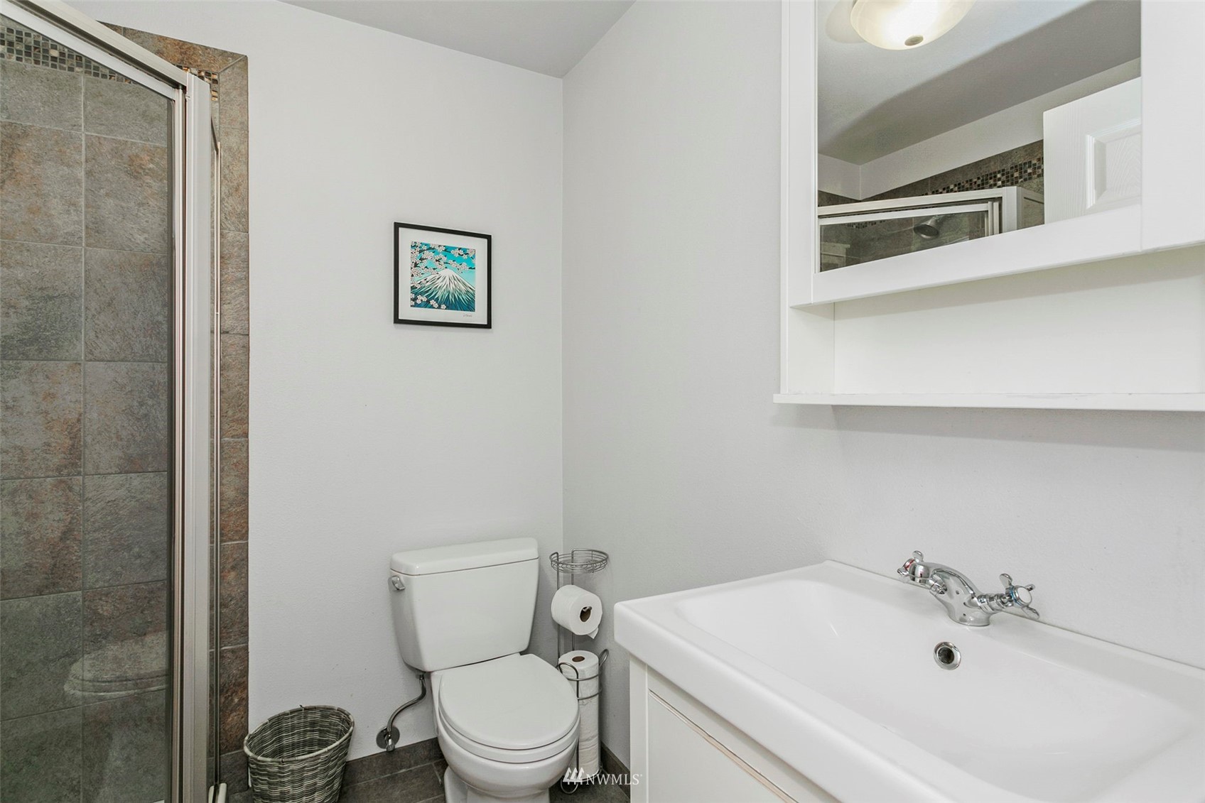 610 219th Place Southwest Bothell, WA 98021 - Photo 18 of 25 a white toilet sitting next to a bathroom sink