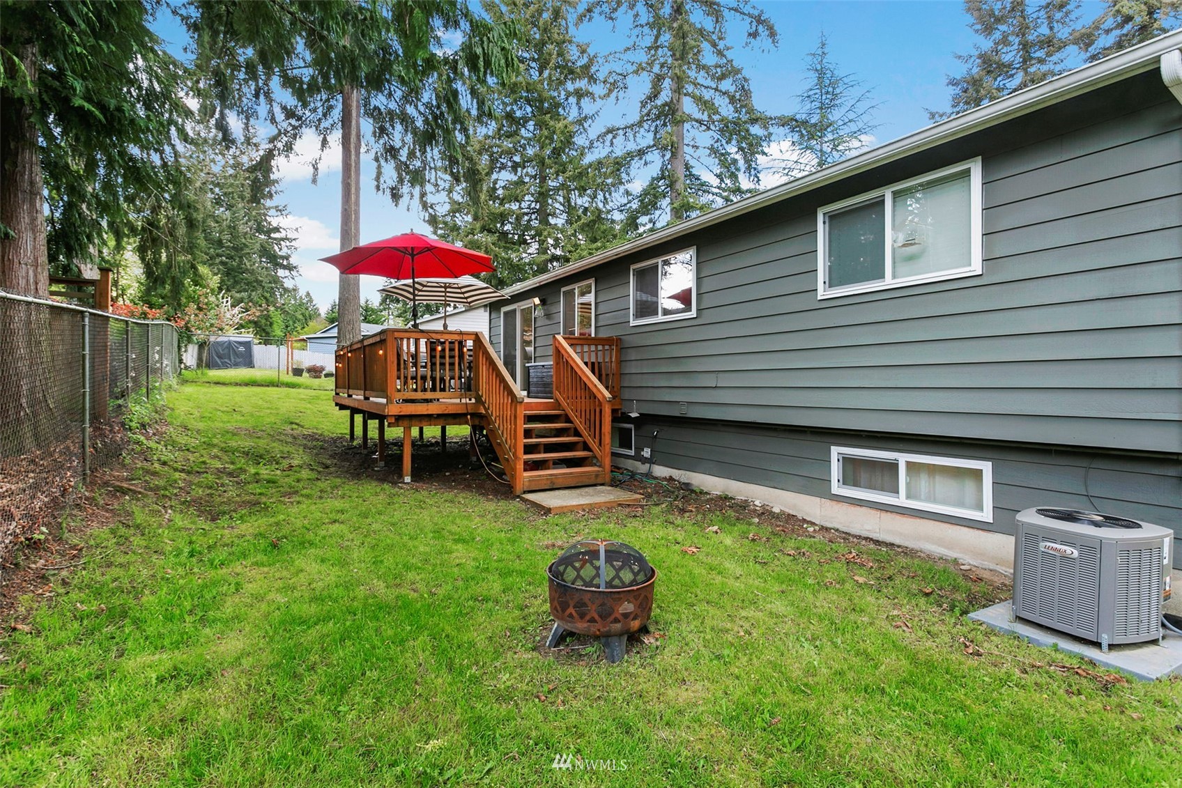 610 219th Place Southwest Bothell, WA 98021 - Photo 22 of 25 a backyard of a house with table and chairs