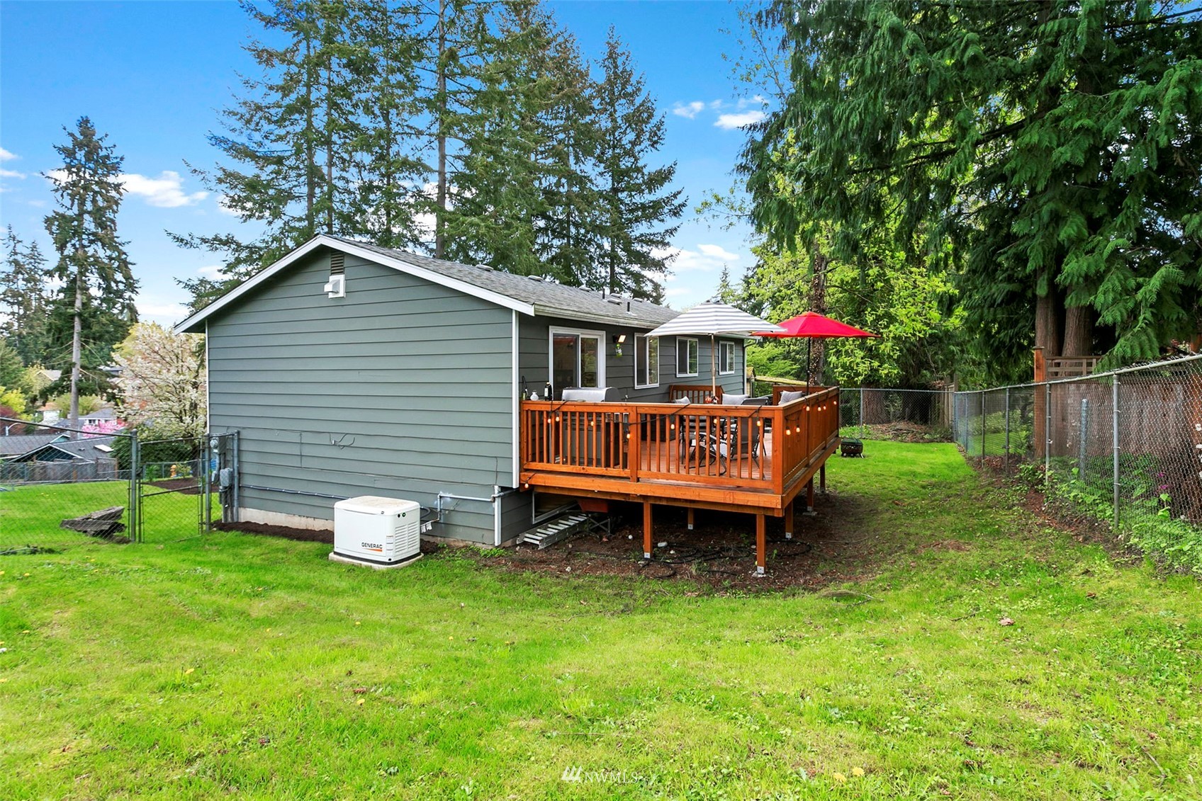 610 219th Place Southwest Bothell, WA 98021 - Photo 23 of 25 a backyard of a house with table and chairs