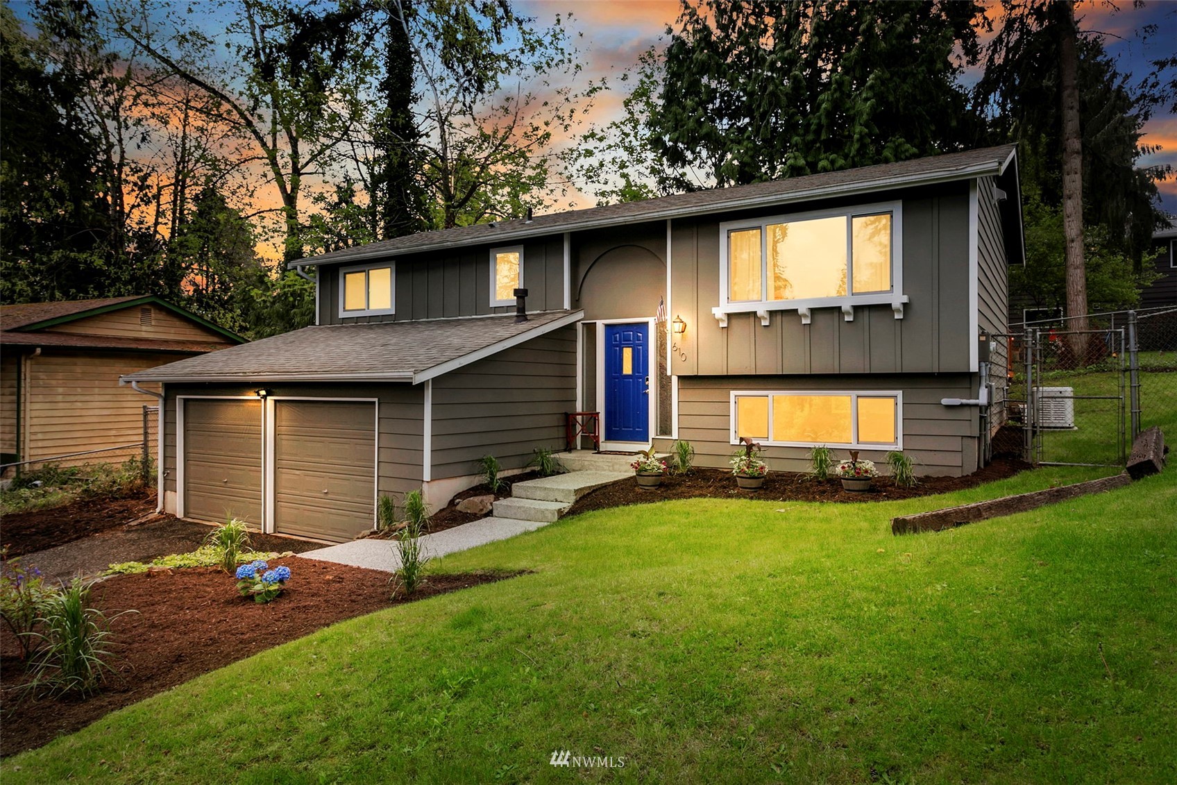 610 219th Place Southwest Bothell, WA 98021 - Photo 25 of 25 a front view of a house with a yard and garage