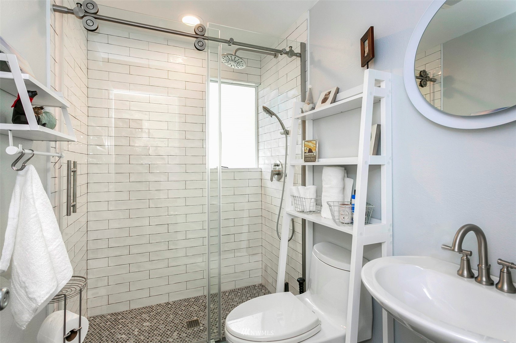 610 219th Place Southwest Bothell, WA 98021 - Photo 10 of 25 a bathroom with a sink a toilet and shower