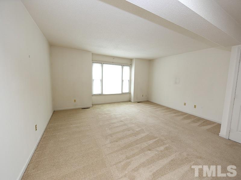 2816 Wycliff Road Raleigh, NC 27607 - Photo 2 of 12 an empty room with a window