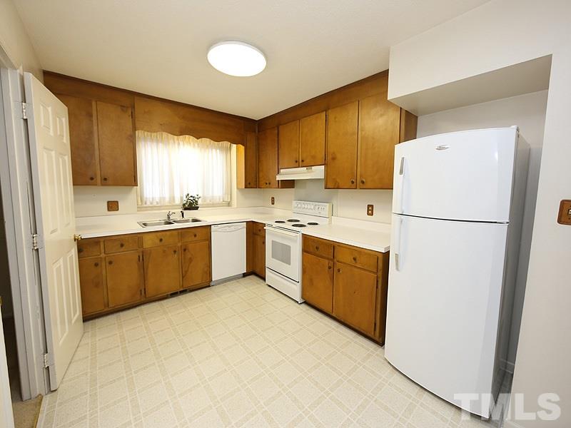 2816 Wycliff Road Raleigh, NC 27607 - Photo 4 of 12 a kitchen with a white refrigerator stove a sink dishwasher and a refrigerator