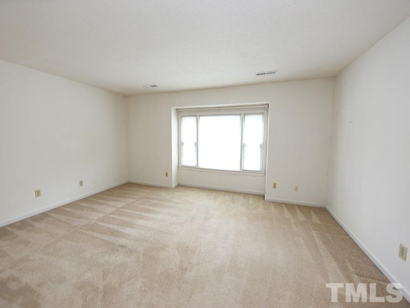 2816 Wycliff Road Raleigh, NC 27607 - Photo 6 of 12 a view of an empty room with a window