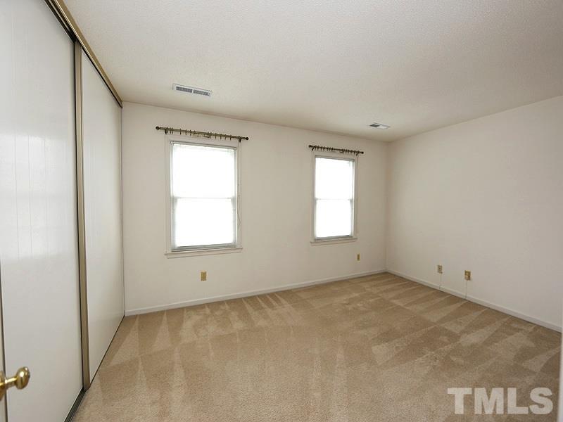 2816 Wycliff Road Raleigh, NC 27607 - Photo 8 of 12 an empty room with windows