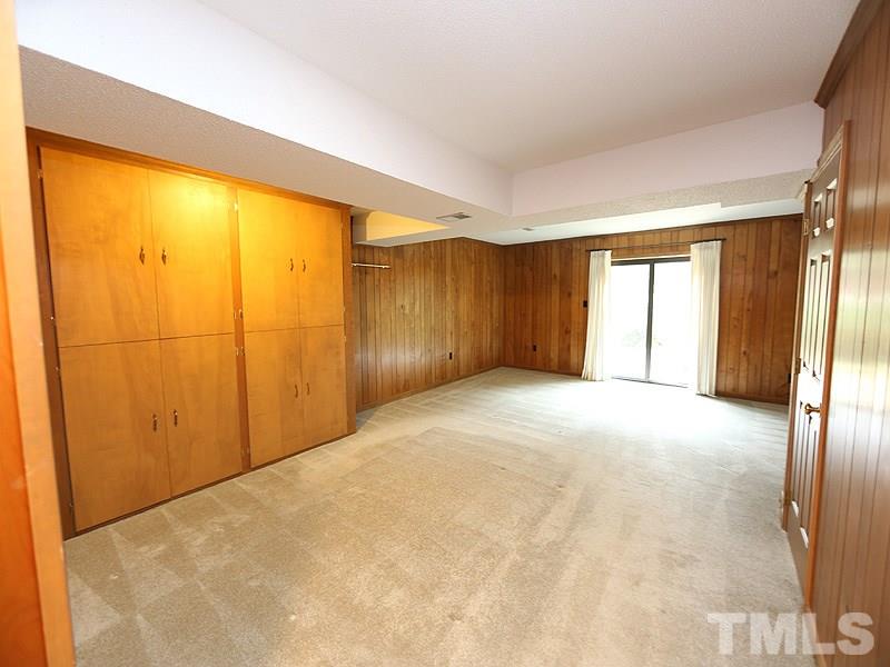 2816 Wycliff Road Raleigh, NC 27607 - Photo 10 of 12 a view of an empty room with a window