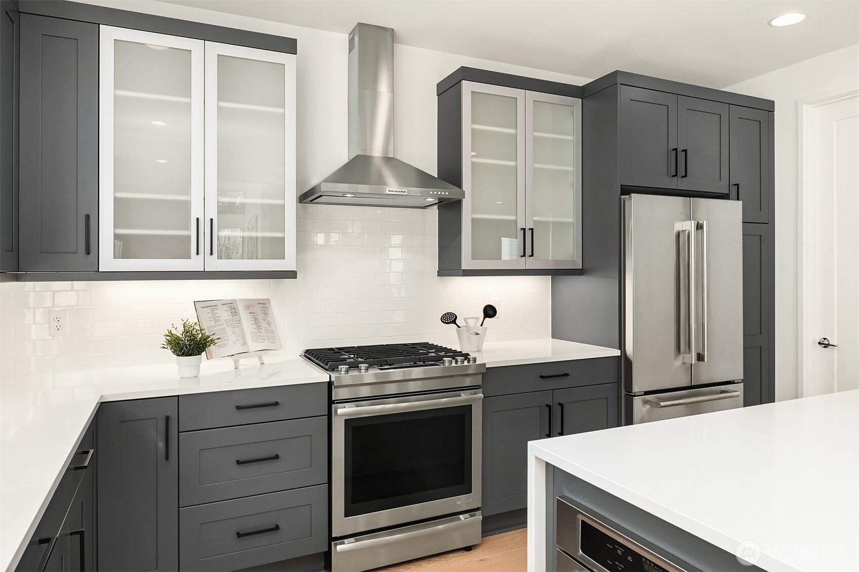 13368 Southeast 68th Place Newcastle, WA 98059 - Photo 12 of 28 a kitchen with stainless steel appliances a stove and a refrigerator with white cabinets