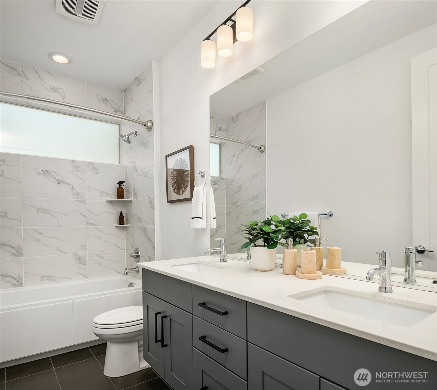 13368 Southeast 68th Place Newcastle, WA 98059 - Photo 18 of 28 a bathroom with a double vanity sink toilet and a bathtub