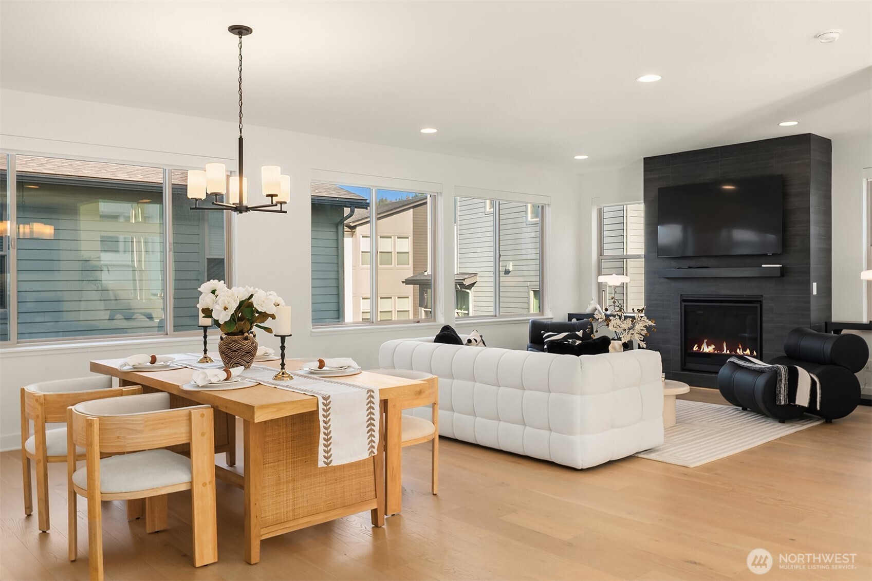 13368 Southeast 68th Place Newcastle, WA 98059 - Photo 19 of 28 a living room with furniture a fireplace and a chandelier