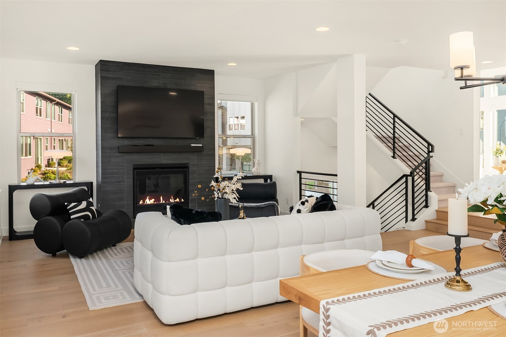 13368 Southeast 68th Place Newcastle, WA 98059 - Photo 4 of 28 a living room with furniture a fireplace and a flat screen tv
