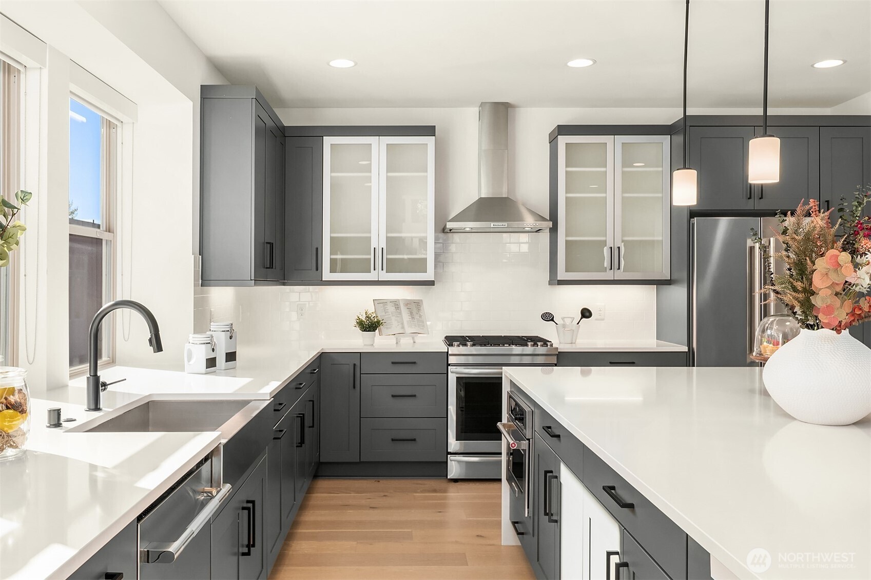 13368 Southeast 68th Place Newcastle, WA 98059 - Photo 9 of 28 a kitchen with stainless steel appliances granite countertop a sink a stove and a refrigerator