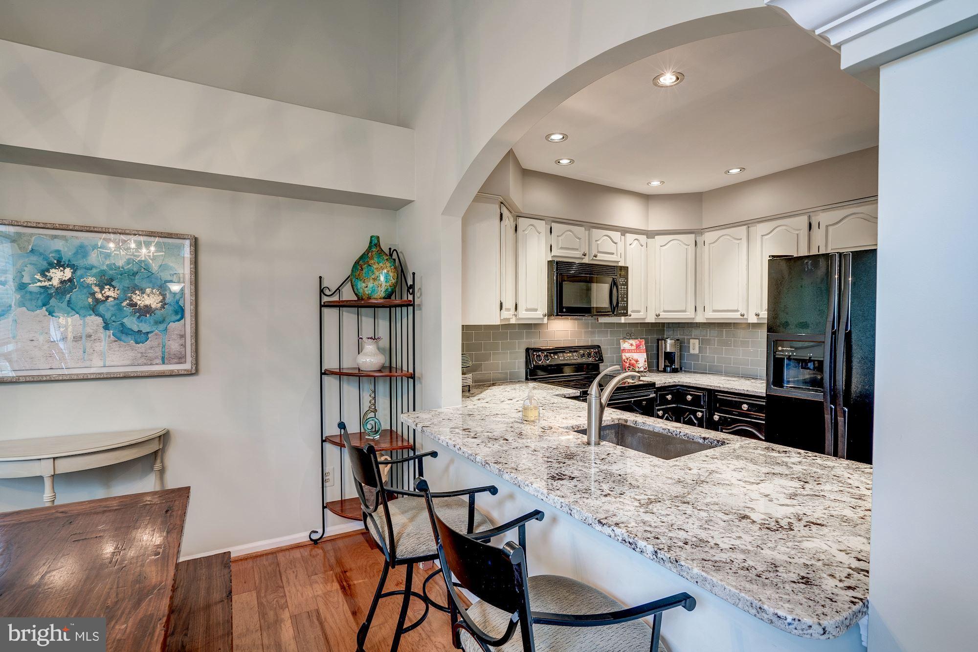 1473 Church Hill Place Reston, VA 20194 - Photo 10 of 46 CUSTOM COUNTER BAR AT KITCHEN