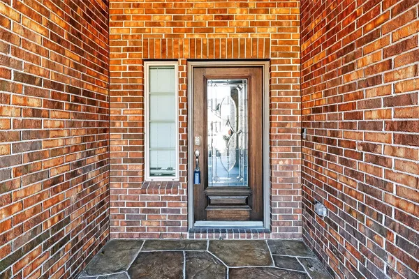 a view of a brick house with a door
