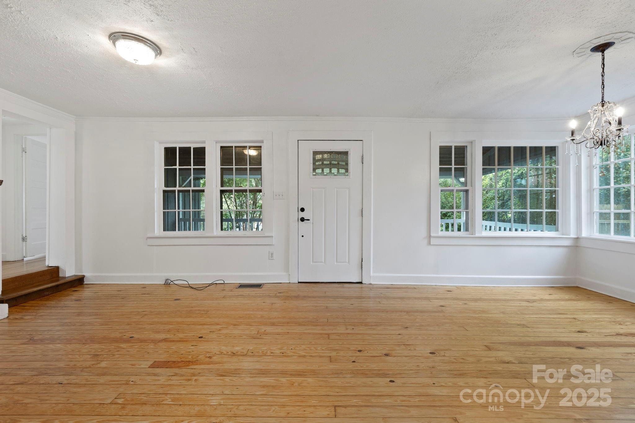 21 Maple Street Brevard, NC 28712 - Photo 14 of 29 a view of an empty room with a window