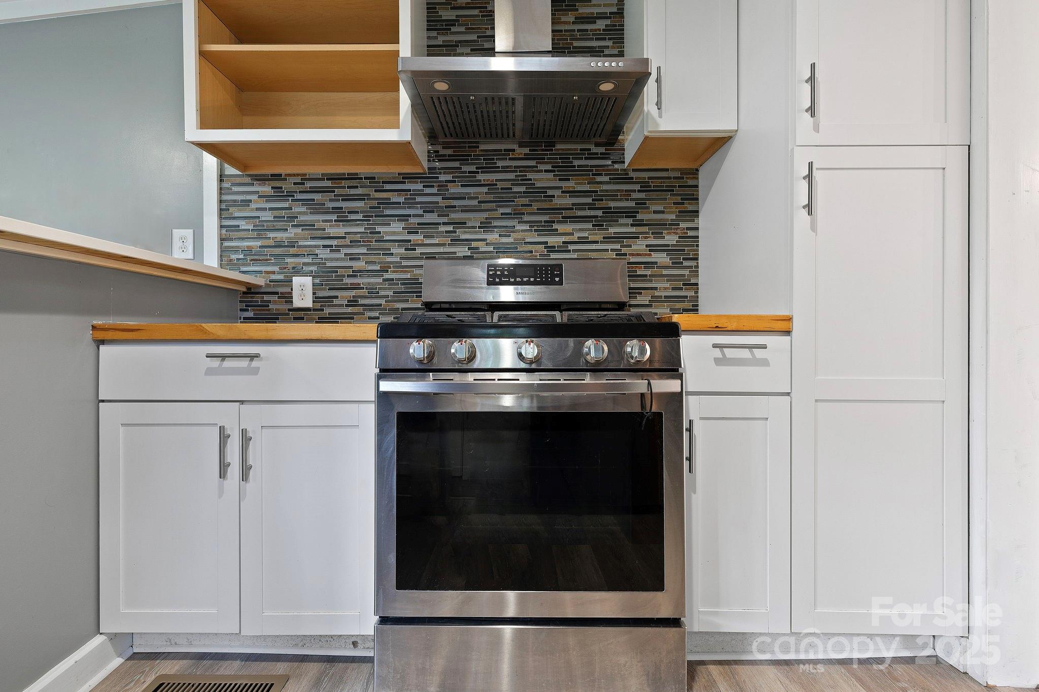21 Maple Street Brevard, NC 28712 - Photo 19 of 29 a stove top oven sitting inside of a kitchen