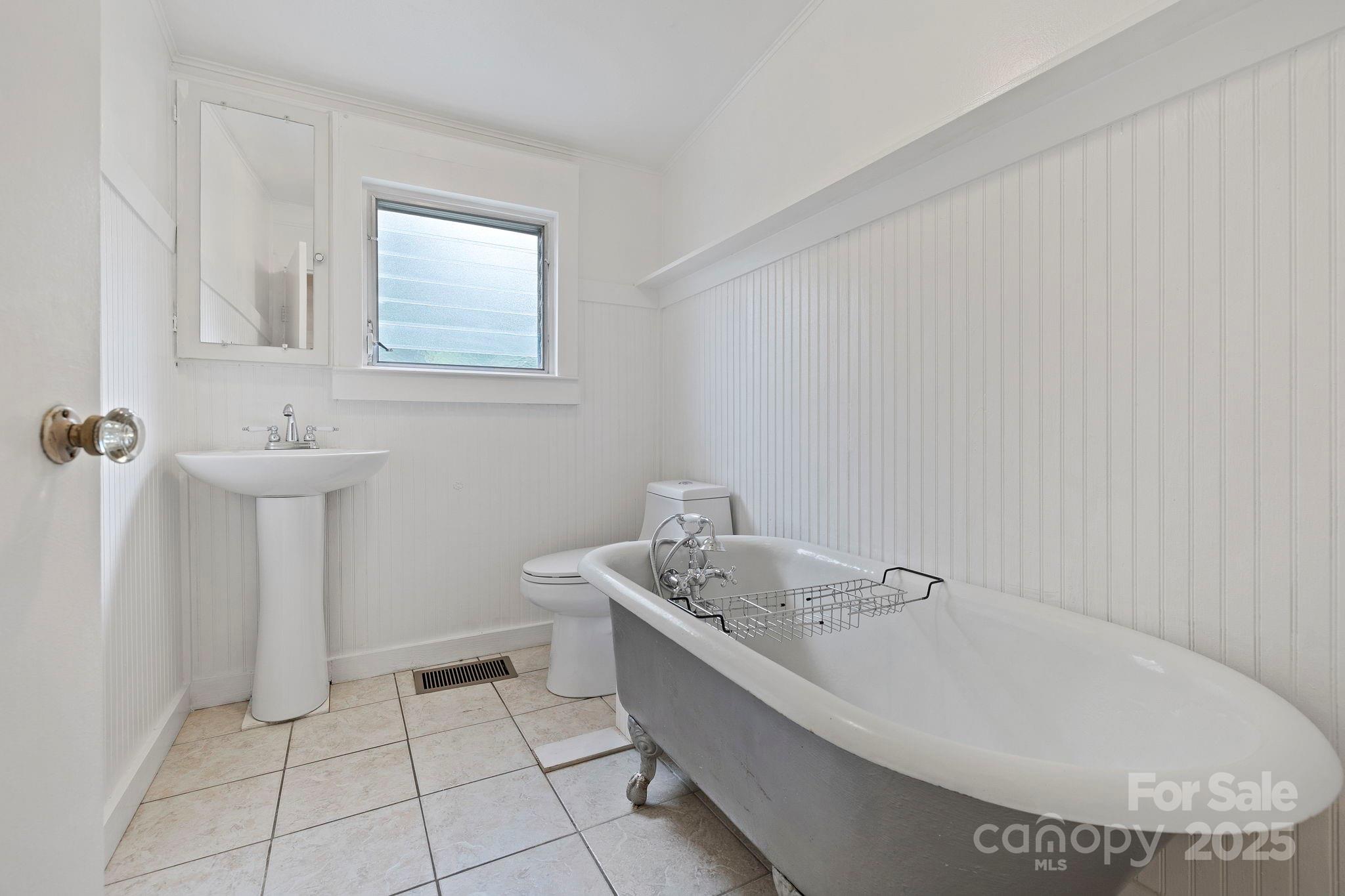 21 Maple Street Brevard, NC 28712 - Photo 25 of 29 a bathroom with a sink and a toilet