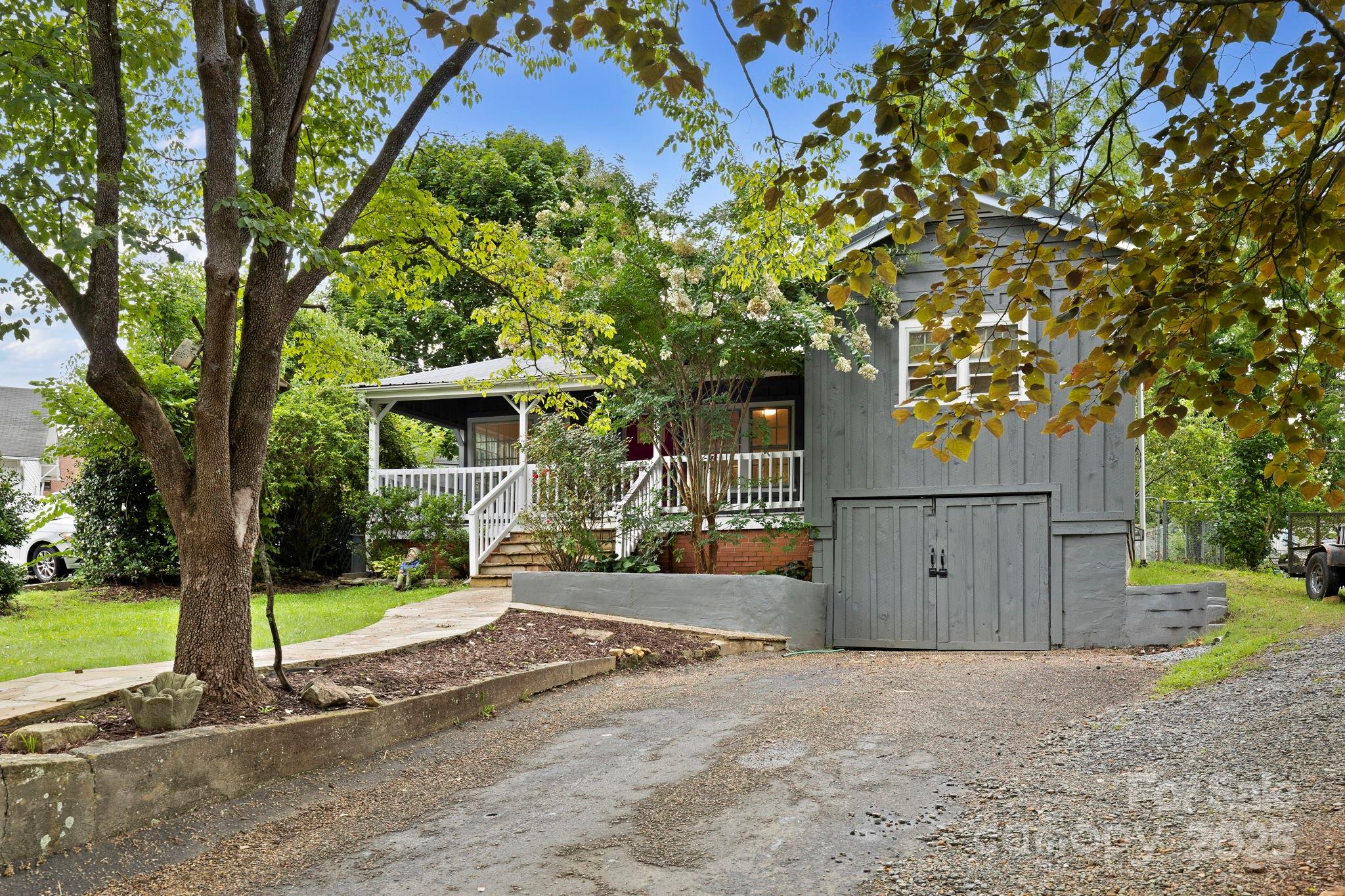 21 Maple Street Brevard, NC 28712 - Photo 3 of 29 a view of a house with a tree in front of it