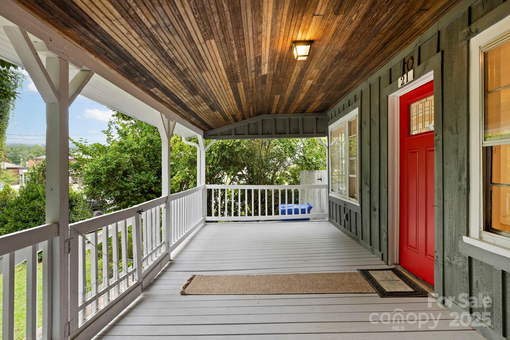 21 Maple Street Brevard, NC 28712 - Photo 4 of 29 a view of a porch with wooden floor and stairs