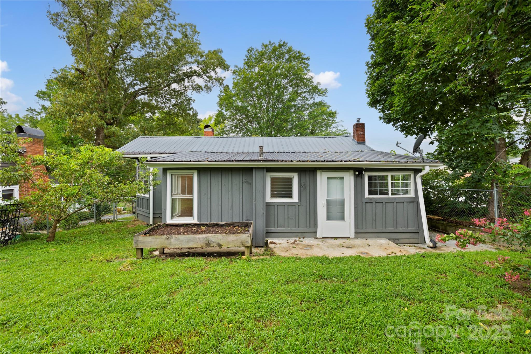 21 Maple Street Brevard, NC 28712 - Photo 7 of 29 a front view of a house with a yard