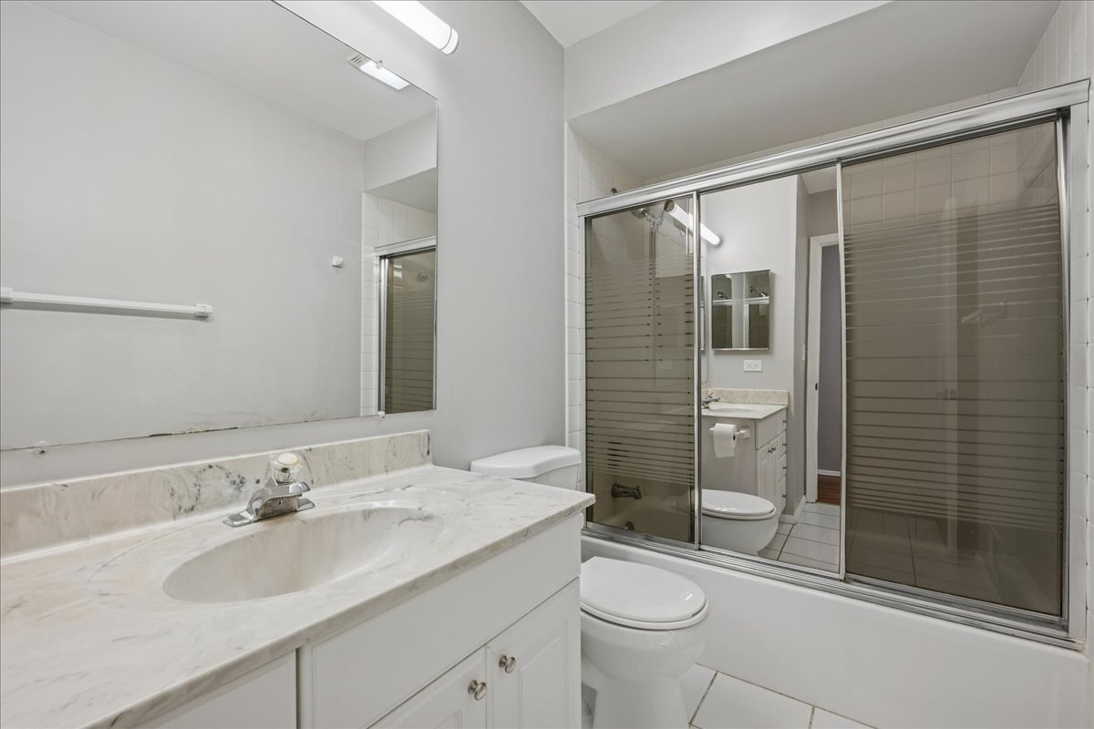 3120 Antelope Springs Road Northbrook, IL 60062 - Photo 19 of 27 a bathroom with a sink toilet and shower
