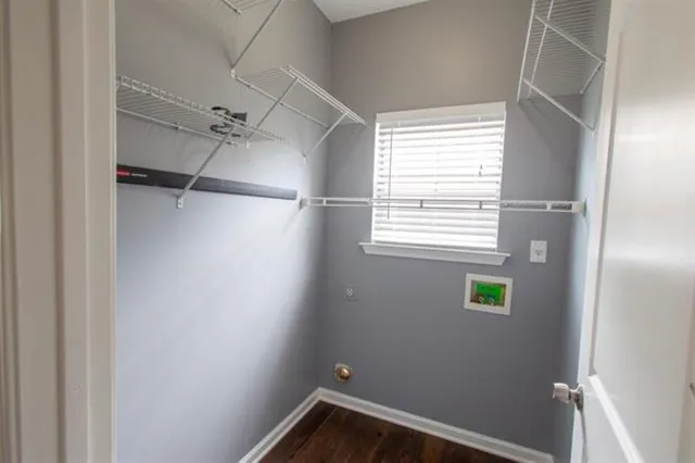 a view of a small space with a window and a fan