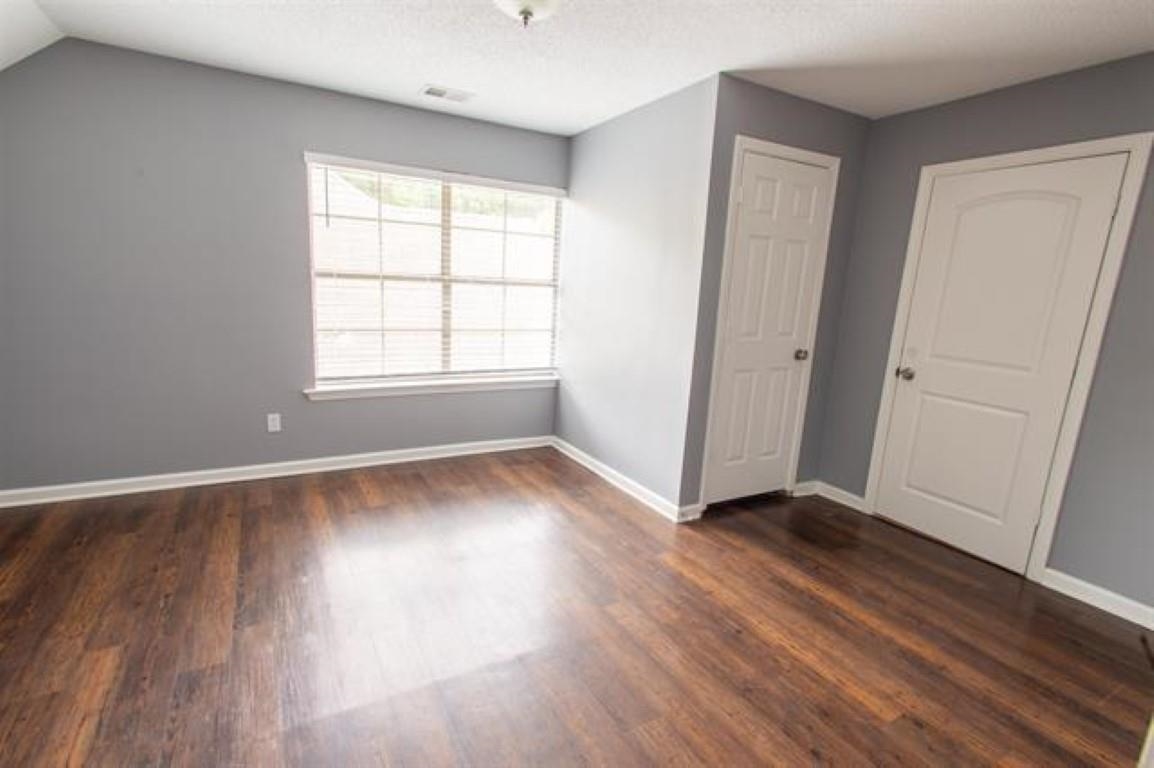 3430 Roxee Run Cove Bartlett, TN 38133 - Photo 20 of 32 an empty room with wooden floor and windows